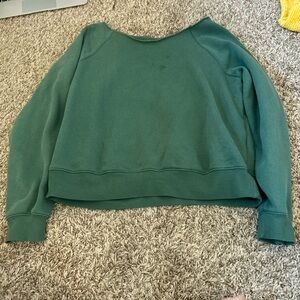 Green off-the-shoulder sweater
